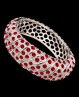 Bracelet fantaisie rigide argenté à strass rouges